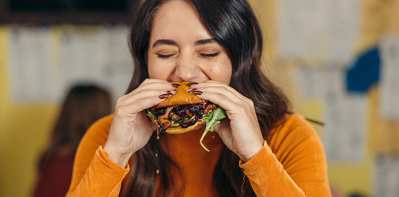 Woman eating burger